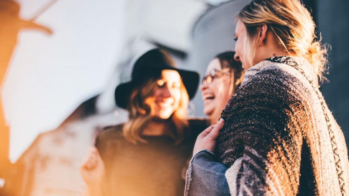 A group of coworkers looks happy and content during a break or team-building activity, sharing lighthearted moments together.