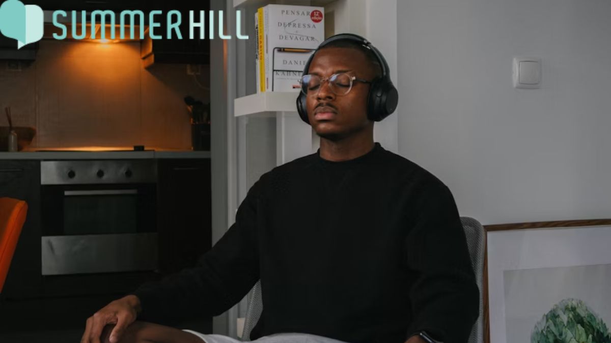 Physical and mental health, a man focuses on deep listening to music for relaxation and well-being.