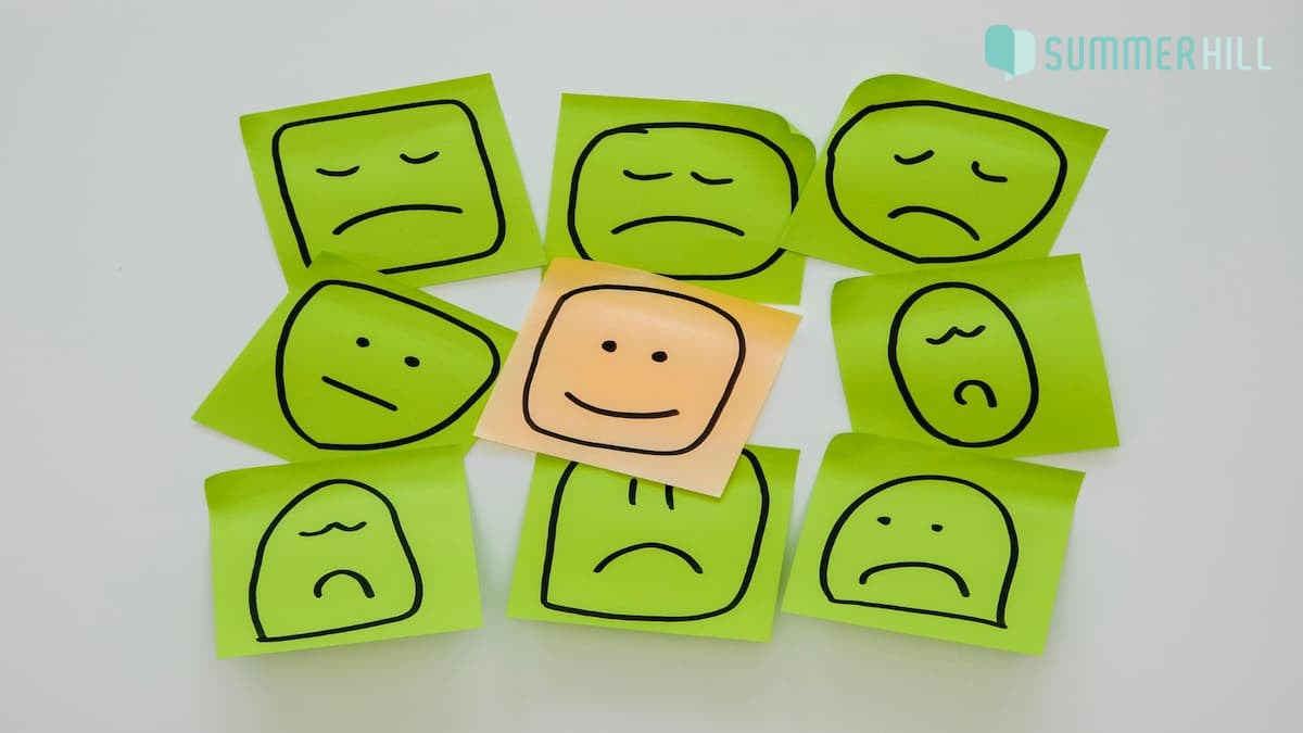 Different mood emojies on a piece of paper