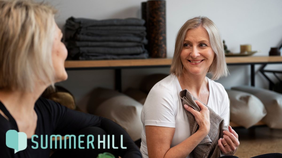 Two women exchange pleasantries after completing a self-care-focused physical activity together.